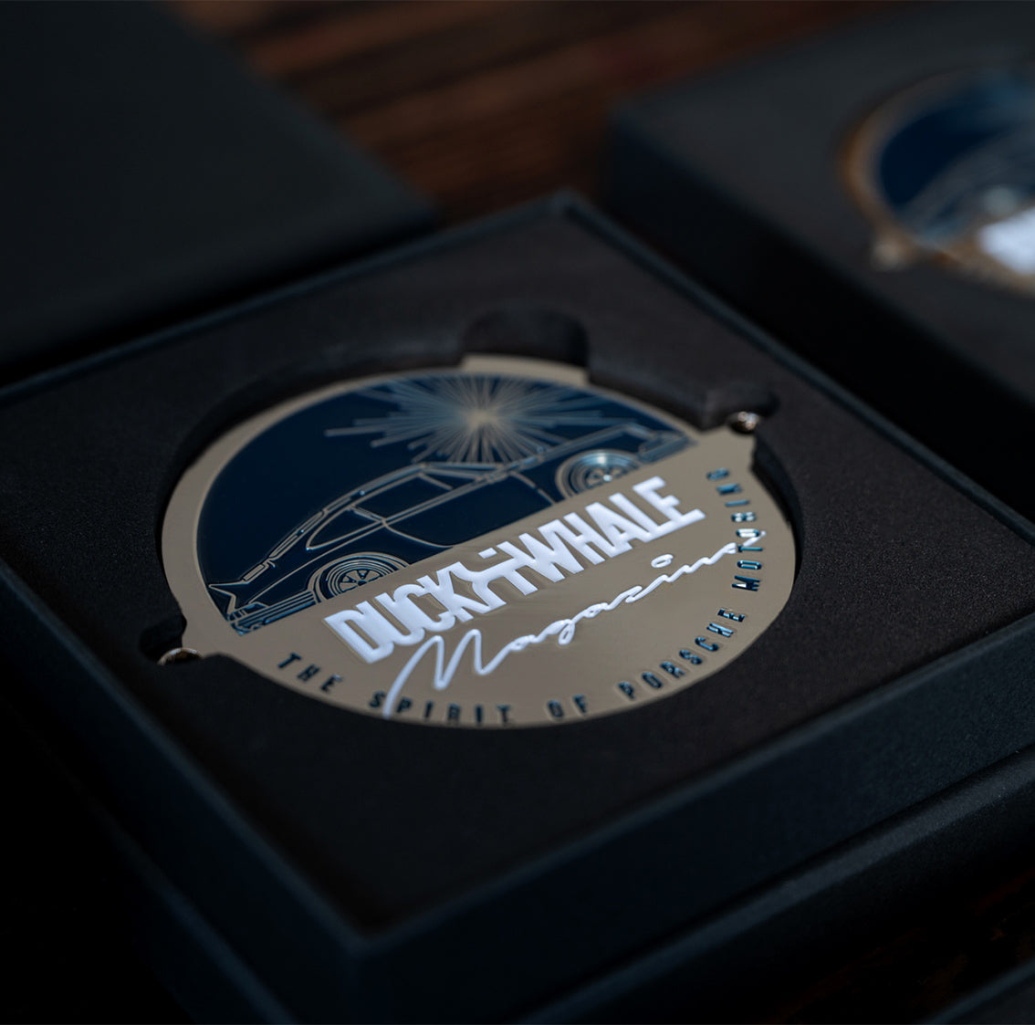 Grill Badge - Silver / Blue D&W The Spirit Of Porsche Motoring